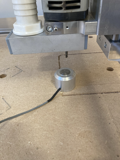 Button under drill